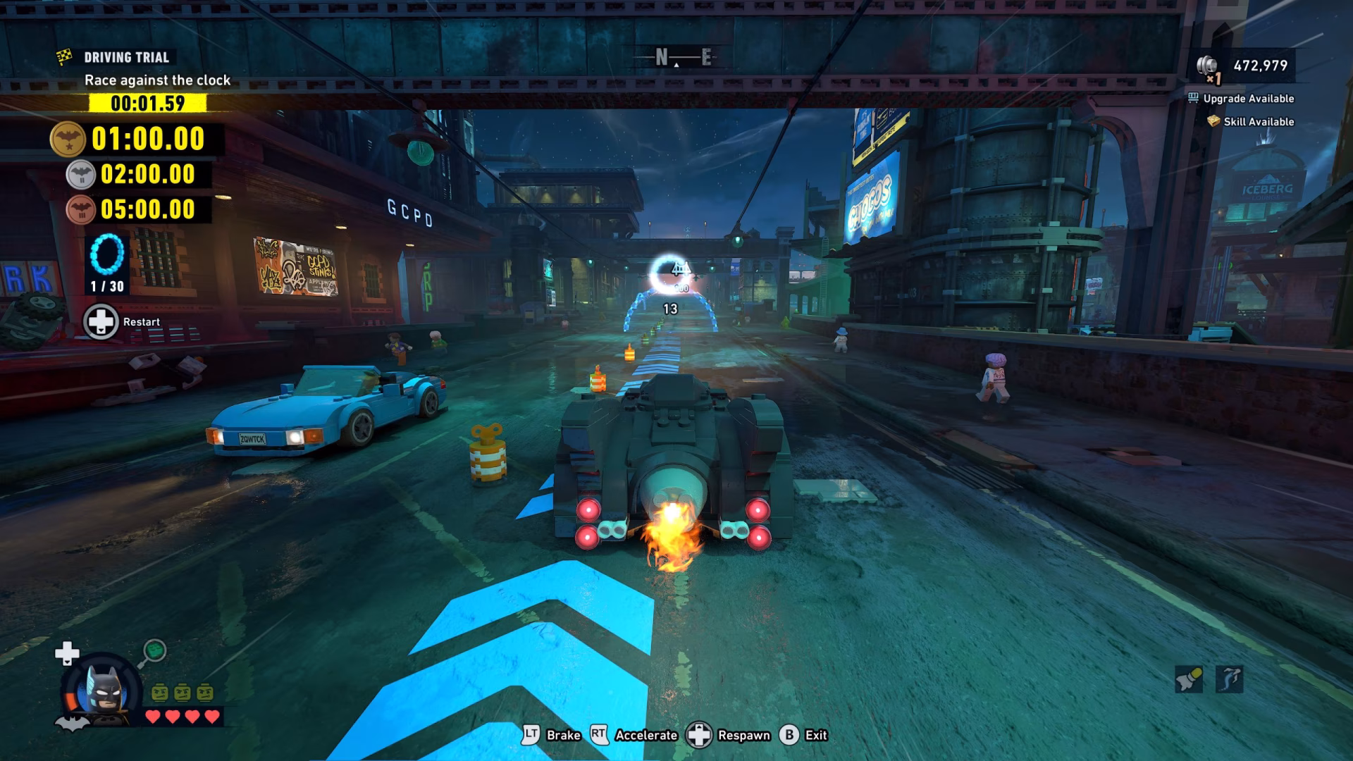 In a LEGO-themed cityscape, Batman drives the Batmobile in 'Driving Trial' with the goal 'Race against the clock' and a time of '00:01.59' displayed.