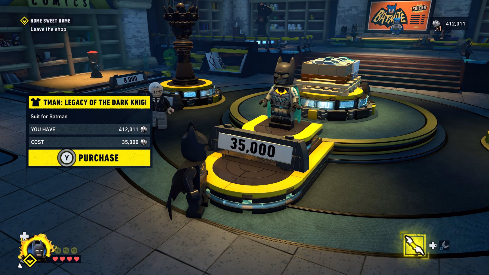 In the game 'LEGO Batman: Legacy of the Dark Knight,' a player is in a shop considering purchasing the Tman: Legacy of the Dark Knight suit for Batman, which costs 35,000 coins, with a visible coin total of 412,011.